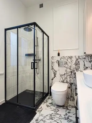 a bathroom with a shower and a toilet and a sink at Apartament Krak Number One in Kraków