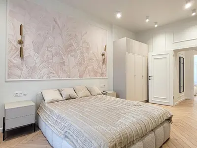 a bedroom with a bed and a painting on the wall at Apartament Krak Number One in Kraków