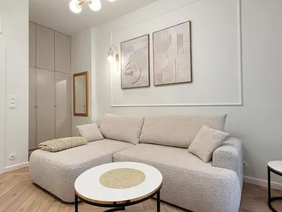 a living room with a couch and a table at Apartament Krak Number One in Kraków