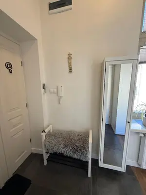 a white kitchen with white cabinets and a sink at KRK-SP Studio in Kraków