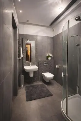 a bathroom with a sink and a toilet and a shower at Urban Nest Apartments Długa 82 in Kraków