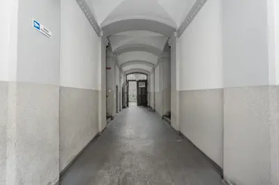 an empty hallway in an office building with a hallway at Starowiślna 14 Downtown Studios by BookingHost in Kraków