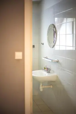 a bathroom with a sink and a mirror at 4Friends&4Couples in Kraków