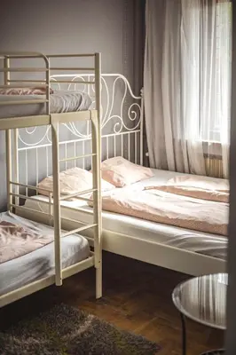 two bunk beds in a room with a window at 4Friends&4Couples in Kraków