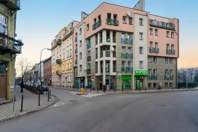 an empty street in front of a building at Traugutta Cozy Studio by BookingHost in Kraków