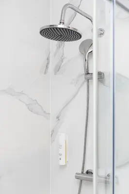 a shower with a shower head in a bathroom at Native Apartments Kościuszki 39I19 in Kraków