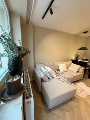 a living room with a couch and a table at Way2Stay Kazimierz in Kraków