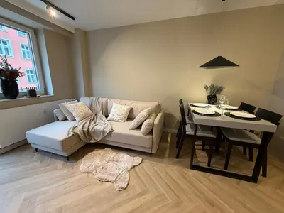 a living room with a couch and a table at Way2Stay Kazimierz in Kraków