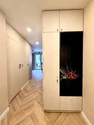 an empty hallway with a large white cabinet at Way2Stay Kazimierz in Kraków