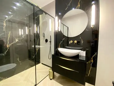 a bathroom with a sink and a mirror at Apartament przy Rakowickiej II Old Town in Kraków