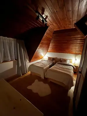 a room with two beds in a attic at Apartament 
