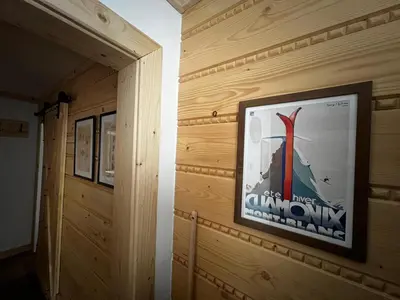 a wall with a picture of a poster on it at Apartament 