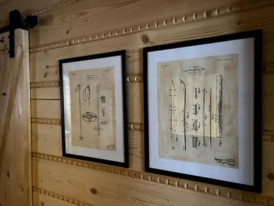 two framed drawings are hanging on a wall at Apartament 