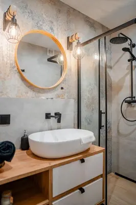 a bathroom with a white sink and a mirror at Podgórze 2-Bedrooms Apartment - 54m2, Air Con - by Rentujemy in Kraków