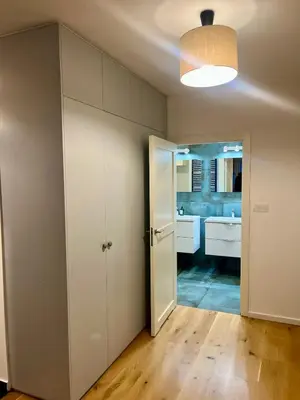 an empty room with a bathroom with a sink at DM Sunny Apartment - Krakow with free private parking in Kraków
