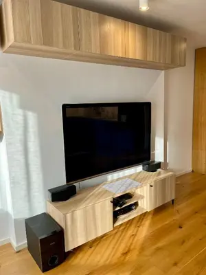 a living room with a large flat screen tv at DM Sunny Apartment - Krakow with free private parking in Kraków