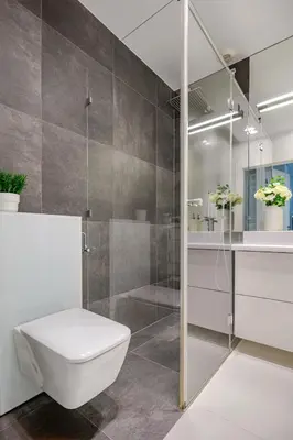 a bathroom with a toilet and a shower at Old Town Apt with AC & Parking, 5 min Main Sq & Kazimierz in Kraków