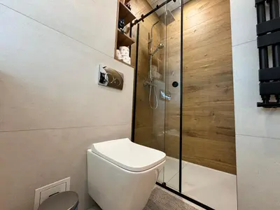 a bathroom with a washing machine and a mirror at Quiet & Stylish Apartment in Old Town 3min from Main Station in Kraków