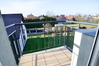 a balcony with a view of a yard at Łagiewniki Apartments Free Parking in Kraków