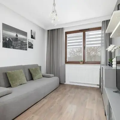 White and Grey Apartment in Cracow with Parking by Noclegi Renters