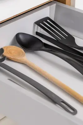 two utensils sitting on top of a drawer at Apartment for two - Krowoderska 21 street in Kraków