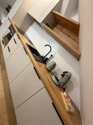a room with a shelf with a lamp on the wall at MICKIEWICZ HOUSE Apartamenty in Wadowice
