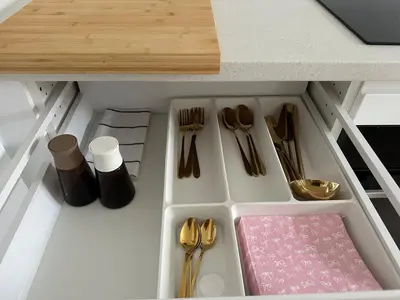a drawer in a kitchen with utensils and utensils at Art Studio Rakowicka in Kraków