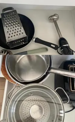 a kitchen counter with a strainer and a pan and a strainer at Art Studio Rakowicka in Kraków