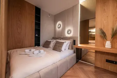 a bedroom with a large white bed in a room at Fleurmont Apartment by Cracovia Prime in Kraków