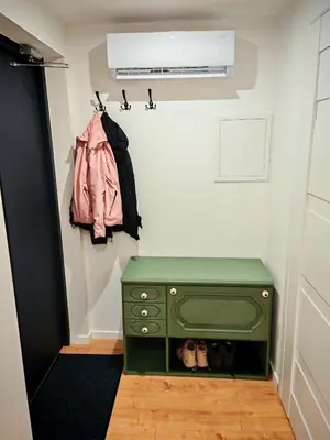 a room with a green chest of drawers and a air conditioner at Beskidzka Oaza 2 in Targanice