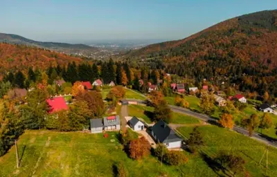 an aerial view of a small town in the mountains at Beskidzka Oaza 2 in Targanice