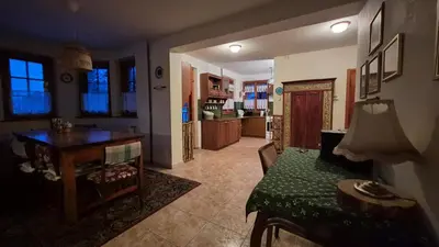 a living room with a couch and a table at Dom na Leśnej - Mszana Dolna in Mszana Dolna