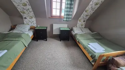 three twin beds in a room with a window at Dom na Leśnej - Mszana Dolna in Mszana Dolna