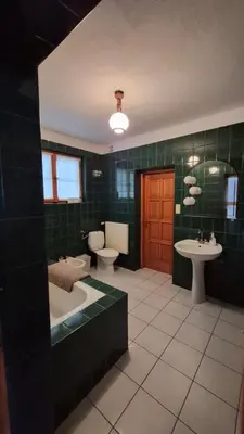 a bathroom with a tub and a toilet and a sink at Dom na Leśnej - Mszana Dolna in Mszana Dolna