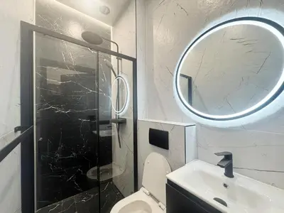 a bathroom with a shower and a toilet and a mirror at Pawlikowskiego nest - 5 minutes walk to Main Square in Kraków