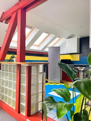a kitchen with colorful walls and a floor with plants at Spacious Apartment with 5 bedrooms and 2 bathrooms for 12 guest in Cracow Old Town in Kraków