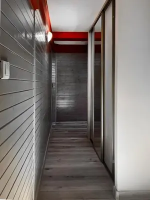 a hallway in a building with a red ceiling at Spacious Apartment with 5 bedrooms and 2 bathrooms for 12 guest in Cracow Old Town in Kraków
