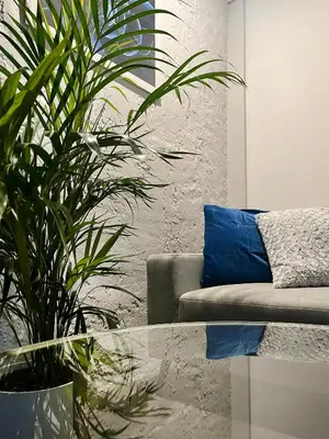 a living room with a couch and a glass table at Spacious Apartment with 5 bedrooms and 2 bathrooms for 12 guest in Cracow Old Town in Kraków