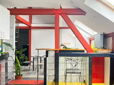a room with a bar with a table and chairs at Spacious Apartment with 5 bedrooms and 2 bathrooms for 12 guest in Cracow Old Town in Kraków