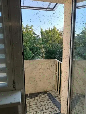a room with a window with a view of a balcony at CityLink Studio - Free Public Parking in Kraków