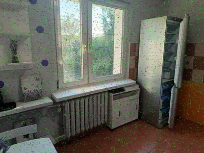 a room with a window and a radiator and a table at CityLink Studio - Free Public Parking in Kraków