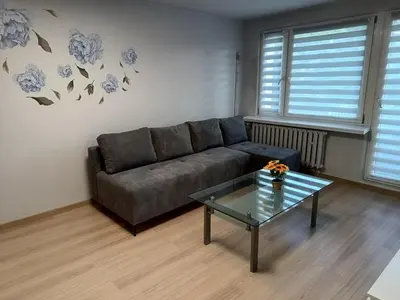 a living room with a couch and a glass table at CityLink Studio - Free Public Parking in Kraków
