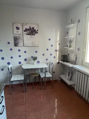 a dining room with purple dots on the wall at CityLink Studio - Free Public Parking in Kraków