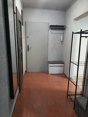 an empty room with a door and a bench at CityLink Studio - Free Public Parking in Kraków