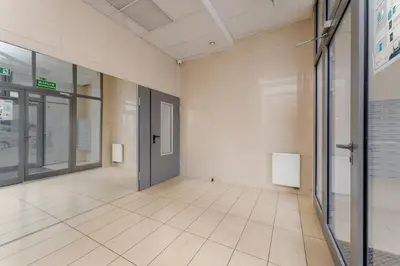 an empty hallway with a door in a building at Tauron Arena Homely Apartment by BookingHost in Kraków