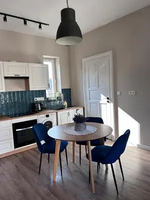a bedroom with a bed and a window at Apartament lawendowy in Kraków