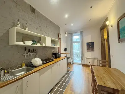 a kitchen with a sink and a counter top at Vintage Dajwor - in the center of Kazimierz in Kraków