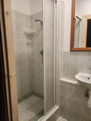 a bathroom with a shower and a sink at Uroczysko pod Babią Górą in Zawoja