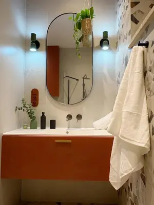 a bathroom with a sink and a mirror at City Heaven Bonarka Kraków in Kraków