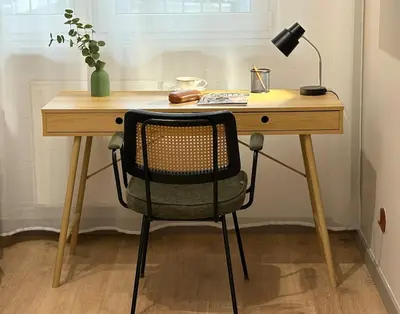 a desk with a chair and a lamp on it at City Heaven Bonarka Kraków in Kraków